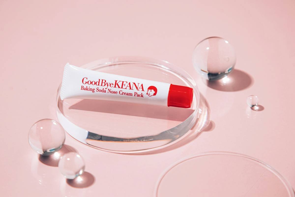 Close-up of irritated red skin caused by cosmetics.