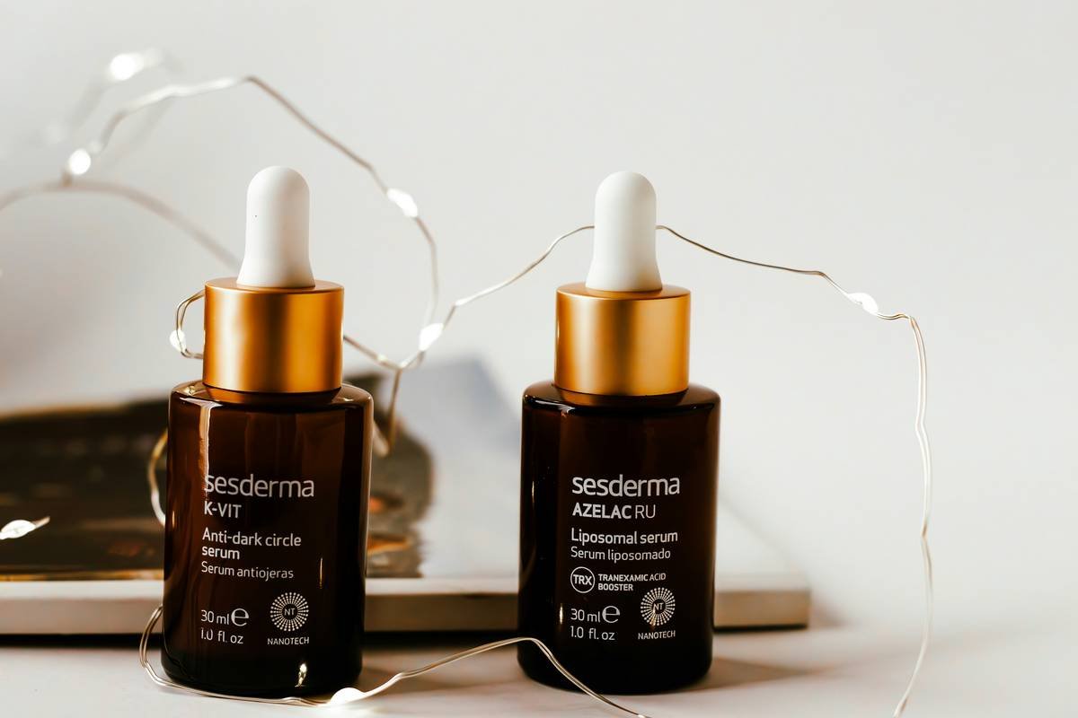 A woman applying gentle concealer on her sensitive skin with a makeup brush