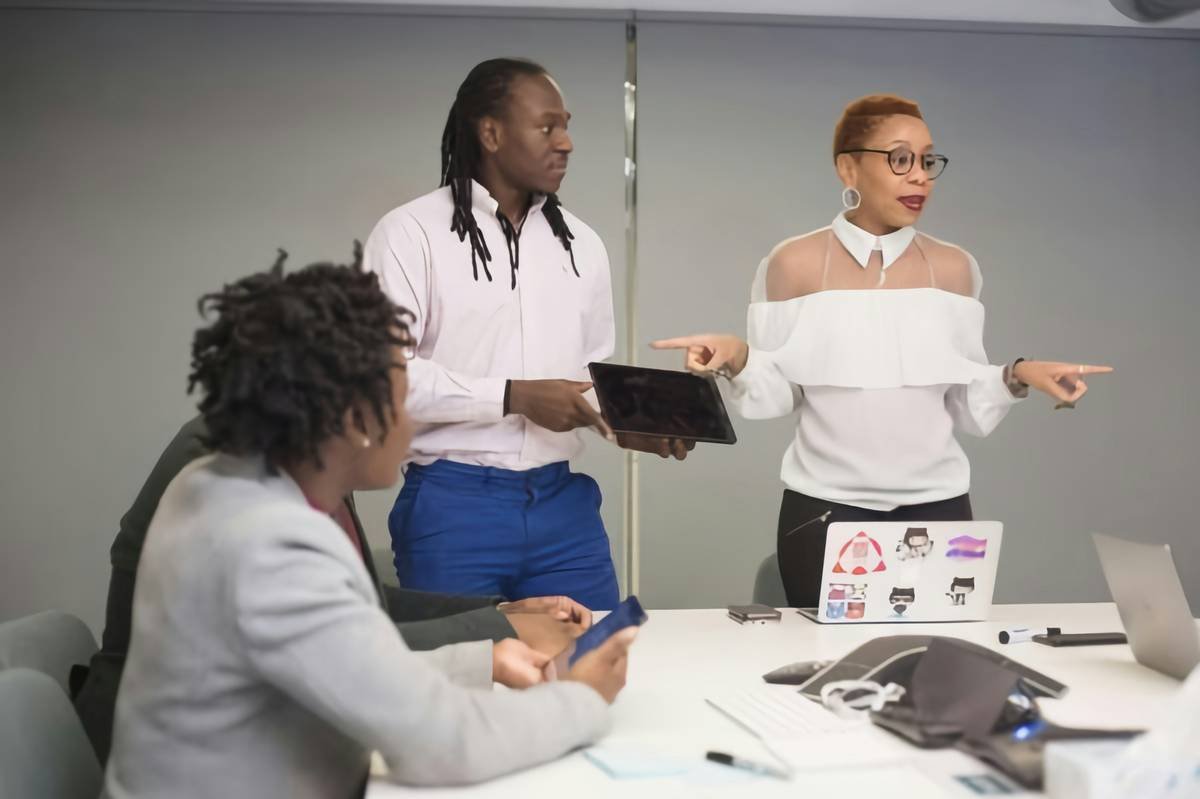 Business people in office on laptop computers